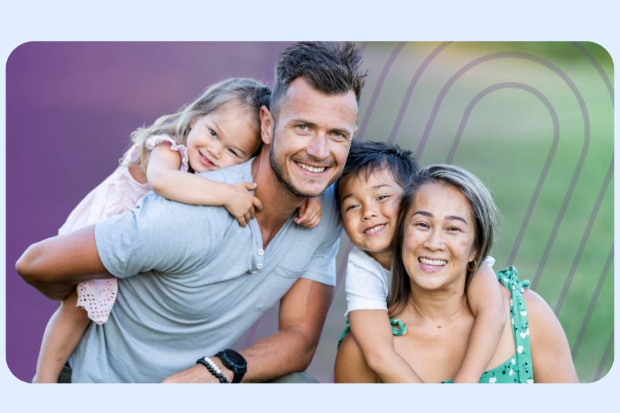 Family of four smiling